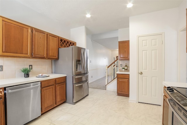 kitchen featuring decorative backsplash and stainless steel appliances