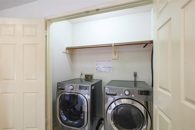 laundry room with washing machine and dryer