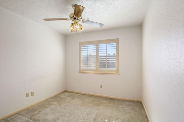 unfurnished room with a textured ceiling, light colored carpet, and ceiling fan