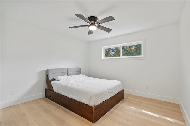 bedroom featuring ceiling fan and light hardwood / wood-style floors