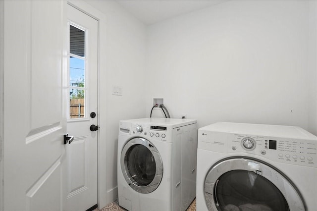 laundry area with washer and clothes dryer