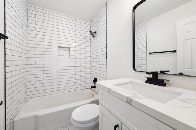 full bathroom featuring vanity, toilet, and tiled shower / bath