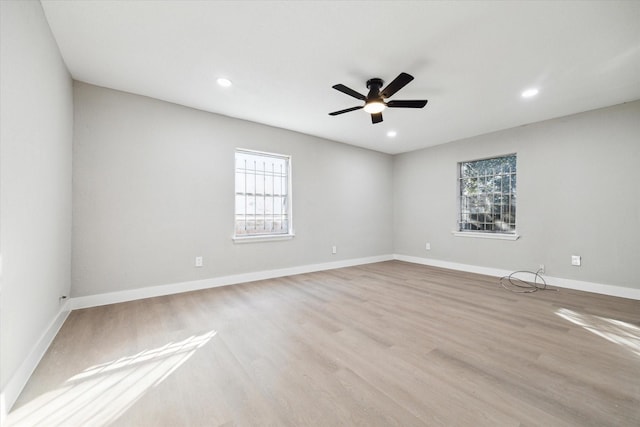 spare room with light hardwood / wood-style floors and ceiling fan