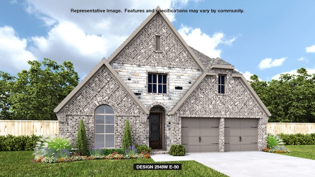 view of front of home featuring a garage and a front lawn