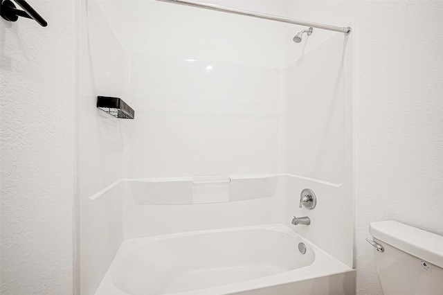 bathroom featuring toilet and tub / shower combination