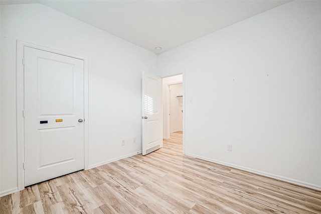 spare room with light hardwood / wood-style floors