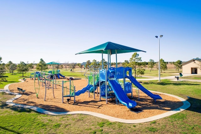 view of play area featuring a lawn