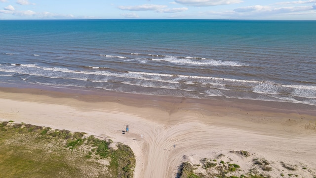 drone / aerial view with a view of the beach and a water view