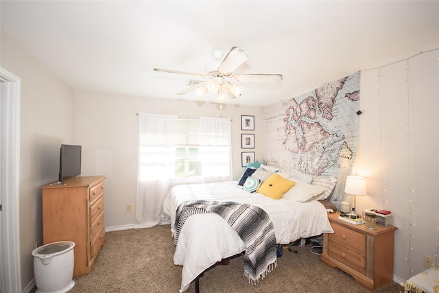 bedroom featuring ceiling fan and light carpet