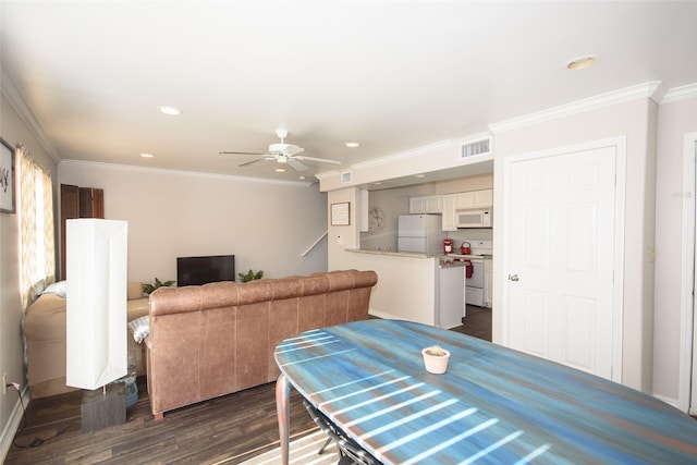 interior space with dark wood-type flooring, ceiling fan, and ornamental molding