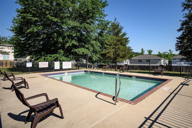 view of swimming pool with a patio area