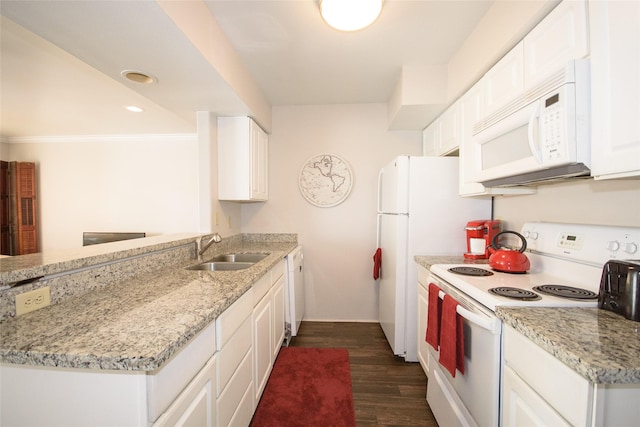 kitchen featuring sink, light stone counters, dark hardwood / wood-style floors, white appliances, and white cabinets