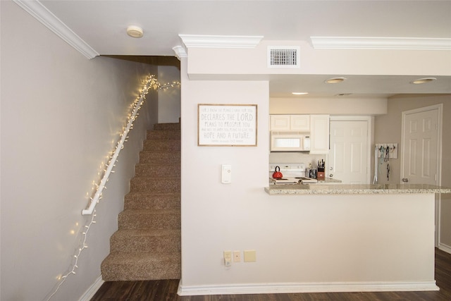 stairway featuring wood-type flooring and ornamental molding