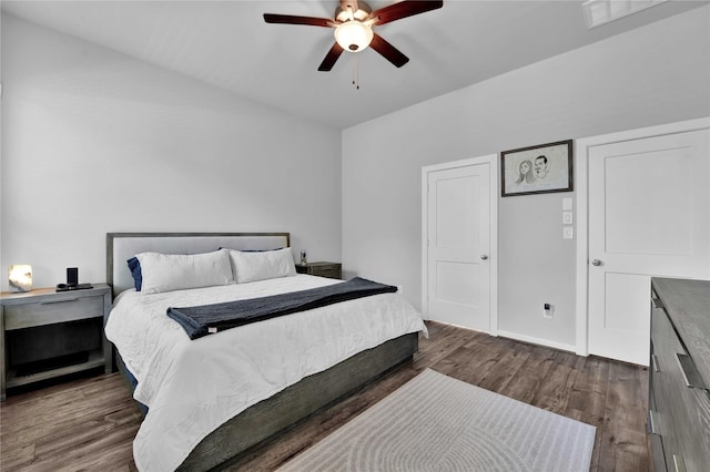 bedroom featuring ceiling fan and dark hardwood / wood-style floors