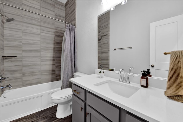 full bathroom with wood-type flooring, vanity, toilet, and shower / bath combo with shower curtain