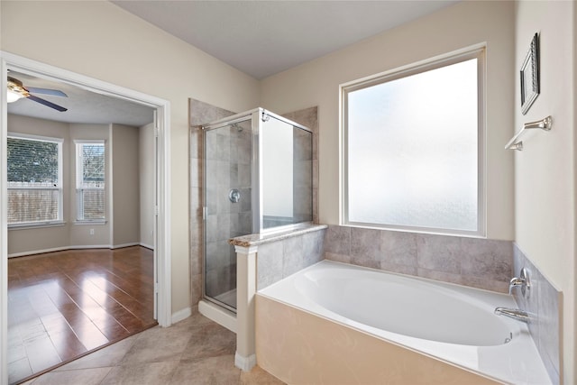 bathroom with ceiling fan, plus walk in shower, and tile patterned flooring