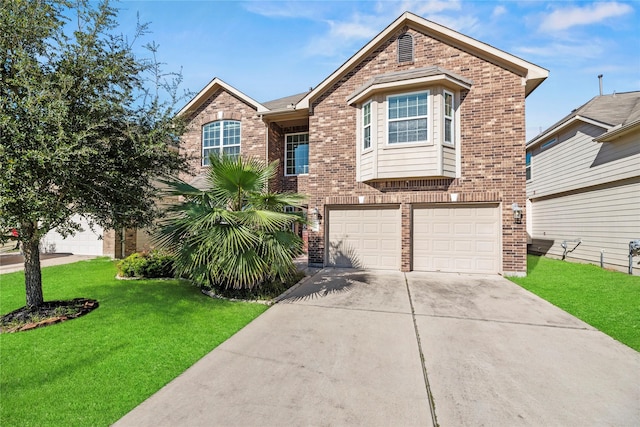 view of front facade with a front yard and a garage