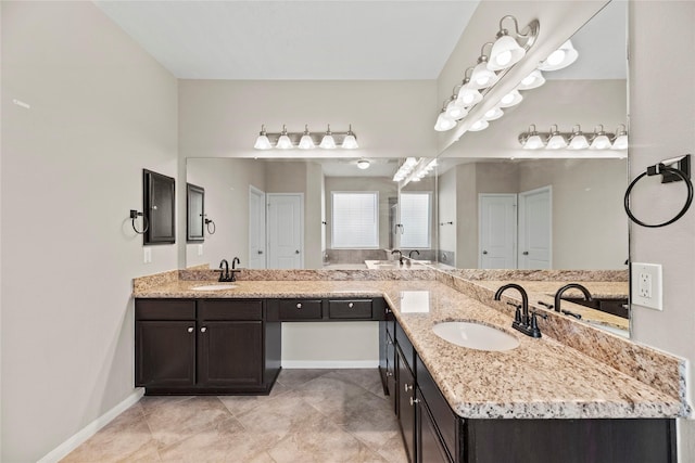 bathroom with tile patterned flooring and vanity