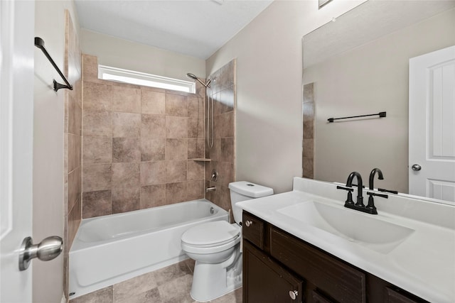 full bathroom featuring tile patterned floors, vanity, toilet, and tiled shower / bath combo