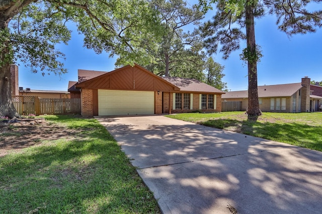 ranch-style home with a garage and a front lawn