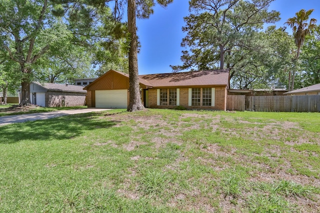 ranch-style house featuring a garage and a front lawn