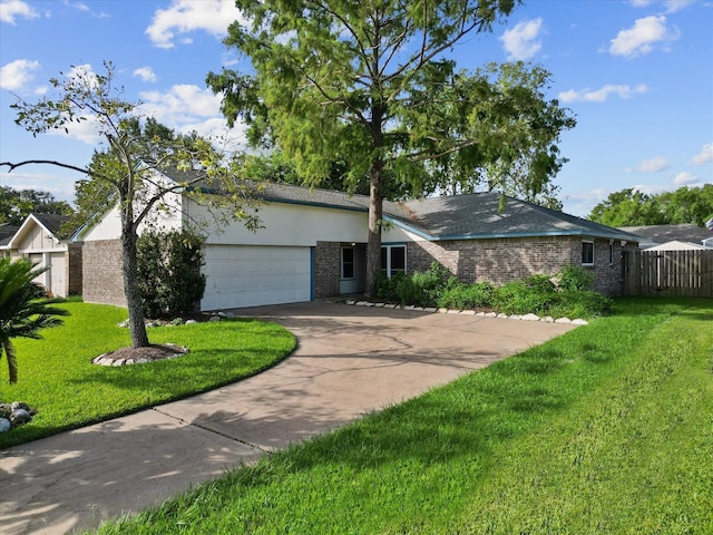 single story home with a front yard and a garage