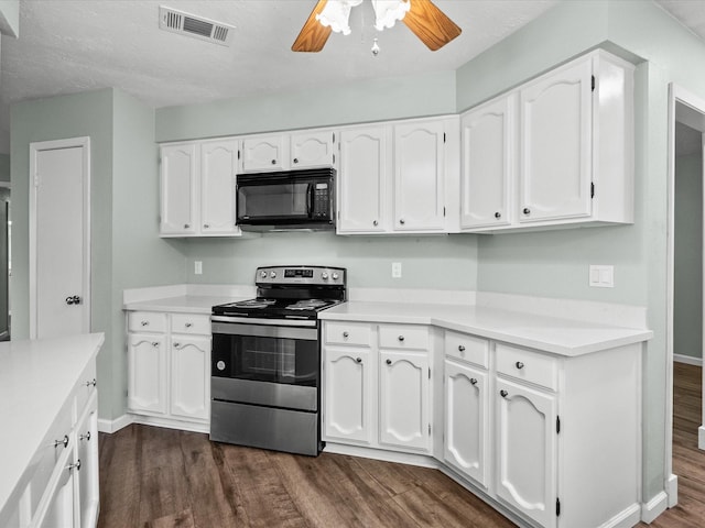 kitchen with electric range, dark hardwood / wood-style flooring, ceiling fan, and white cabinets