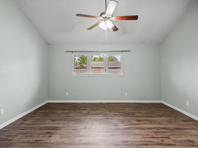 empty room with ceiling fan and dark wood-type flooring