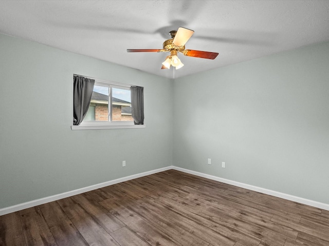 spare room featuring ceiling fan and hardwood / wood-style floors