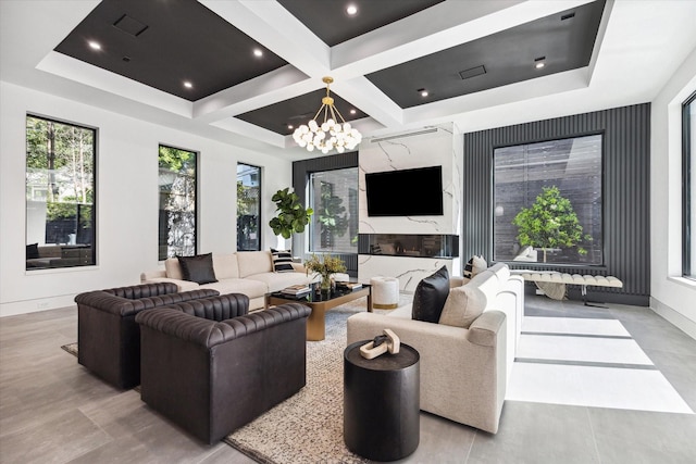 living room with coffered ceiling, beamed ceiling, and an inviting chandelier