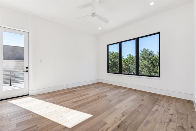 unfurnished room featuring light hardwood / wood-style flooring and ceiling fan