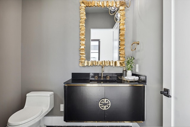 bathroom with vanity and toilet