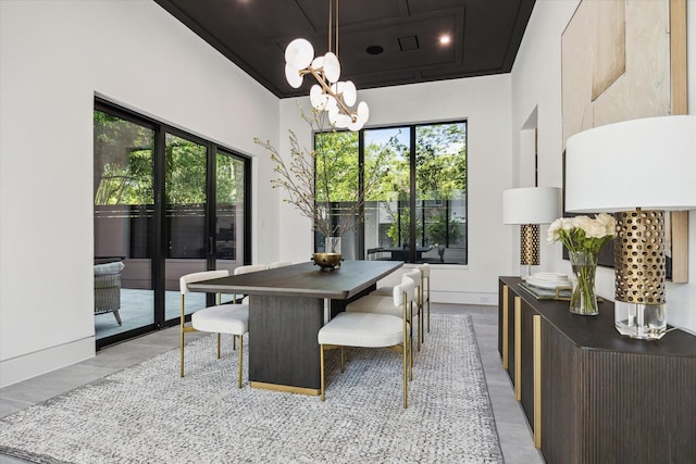 dining room with plenty of natural light and a notable chandelier