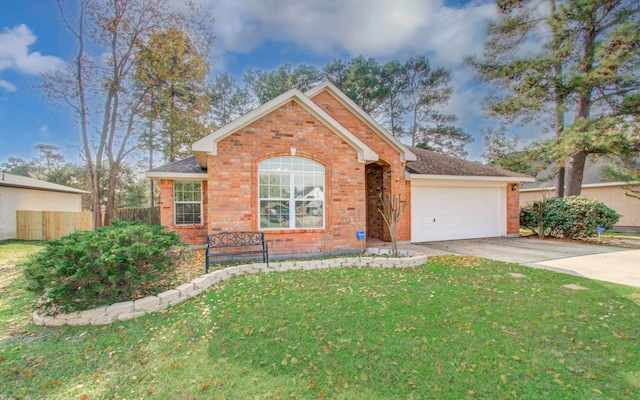 view of front of home with a garage and a front lawn