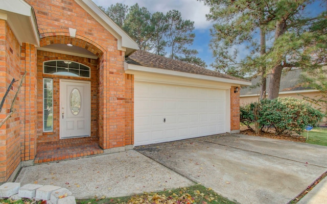 view of exterior entry featuring a garage