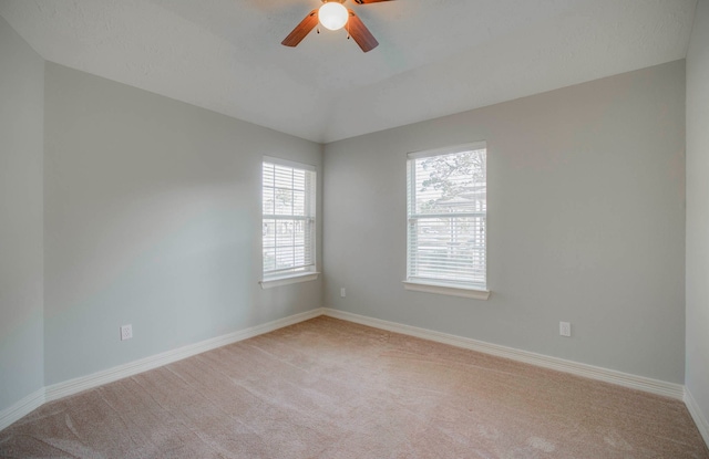 unfurnished room featuring light carpet and ceiling fan