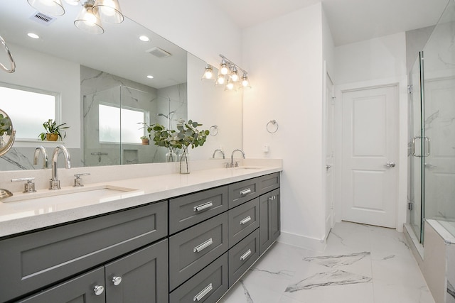 bathroom featuring vanity and a shower with shower door