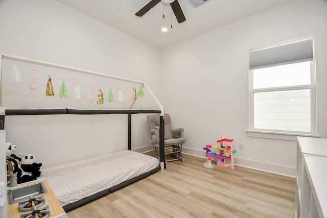 bedroom featuring ceiling fan and light wood-type flooring