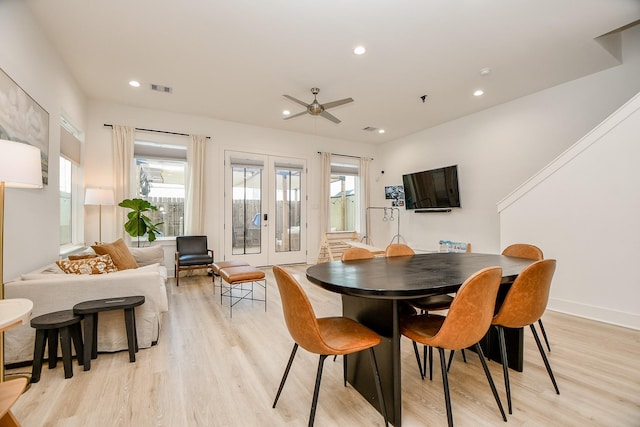 dining room featuring ceiling fan, light hardwood / wood-style floors, plenty of natural light, and french doors