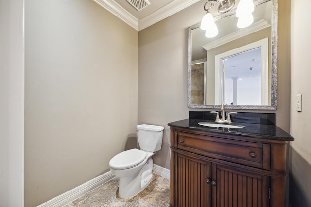 bathroom with vanity, toilet, and crown molding