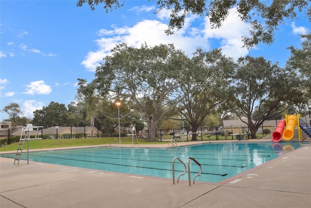 view of pool featuring a playground