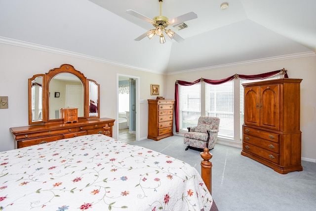 bedroom with crown molding, light carpet, ceiling fan, connected bathroom, and lofted ceiling