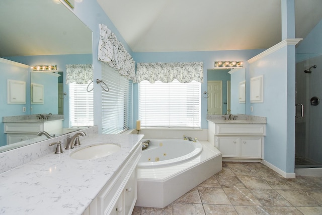 bathroom featuring vanity, vaulted ceiling, and plus walk in shower