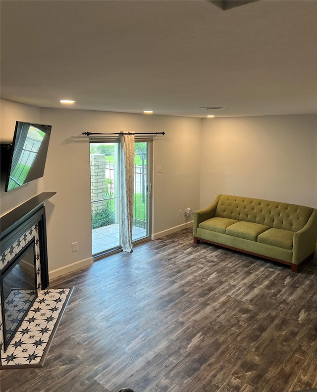 living room with dark hardwood / wood-style floors