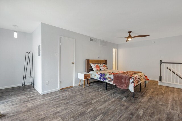 bedroom featuring ceiling fan and dark hardwood / wood-style flooring