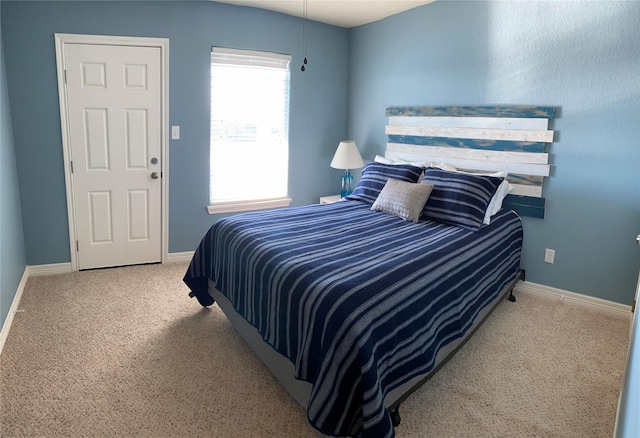 bedroom with light colored carpet