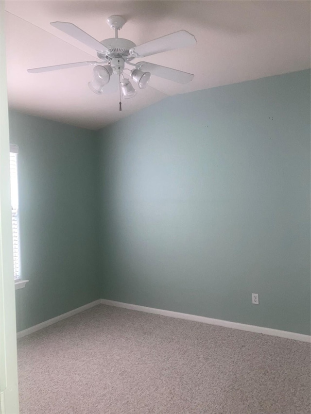 empty room featuring carpet floors and ceiling fan