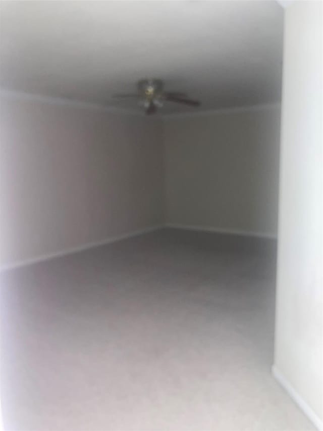 unfurnished room with ceiling fan