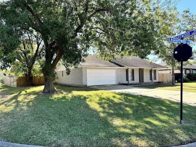 ranch-style house with a front yard and a garage