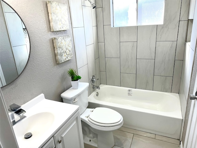 full bathroom with vanity, tiled shower / bath combo, and toilet